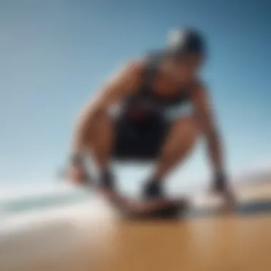 Rider adjusting flex bindings for optimal fit on the beach