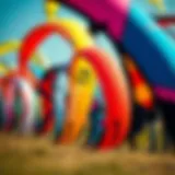 A vibrant selection of kiteboarding kites displayed outdoors