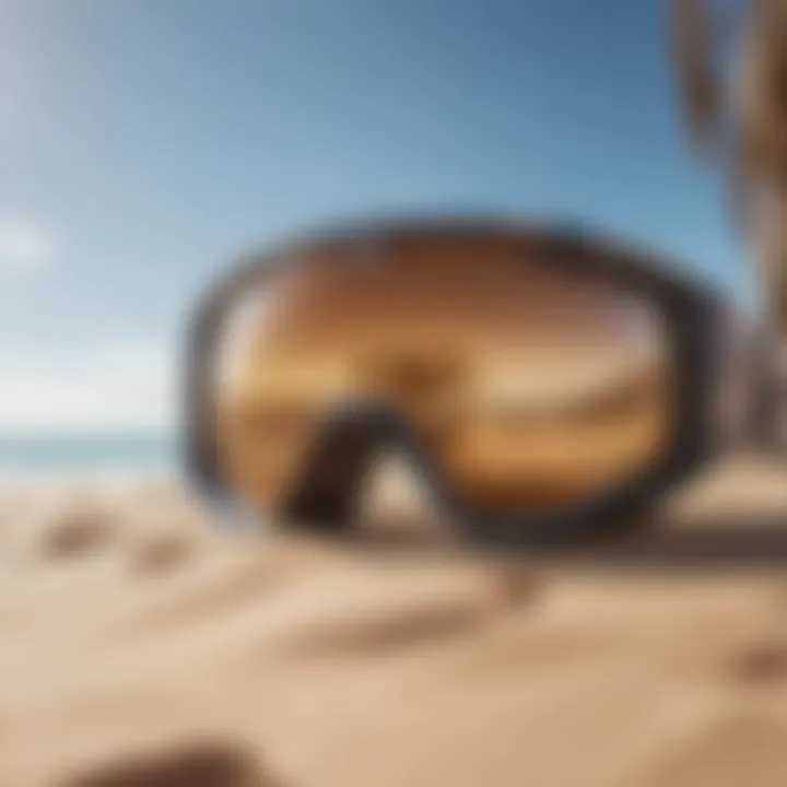 A stylish pair of kitesurf glasses on a sandy beach backdrop