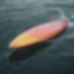 A sleek foil surfboard gliding over the water