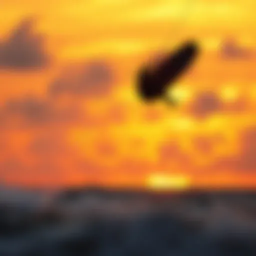 Kiteboarder in Action at Sunset Kiteboarder catching air against a stunning sunset