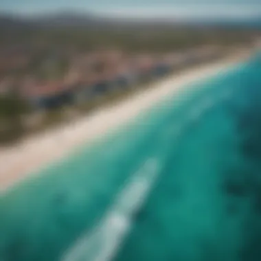 Aerial View of Kiteboarding in North Sardinia A breathtaking aerial view of kiteboarders gliding over the turquoise waters of North Sardinia