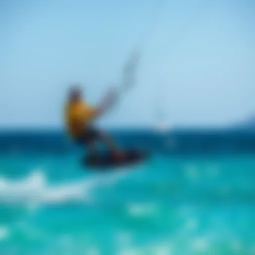 Kiteboarder gliding over turquoise waters