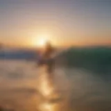 A surfer catching a wave at sunset on Tel Aviv's beach