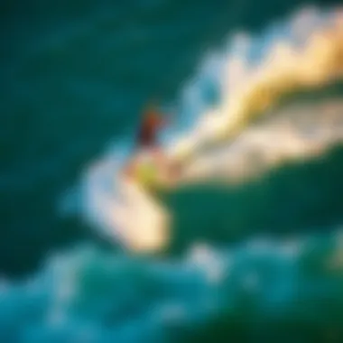 Performance of Foiling Boards in Action An aerial shot of a kiteboarder skillfully maneuvering on a foiling board above the water.