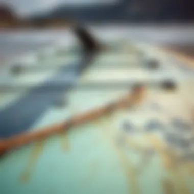 Assessing the Quality of Pre-Owned Boards Close-up of a used wing foil board showcasing its condition