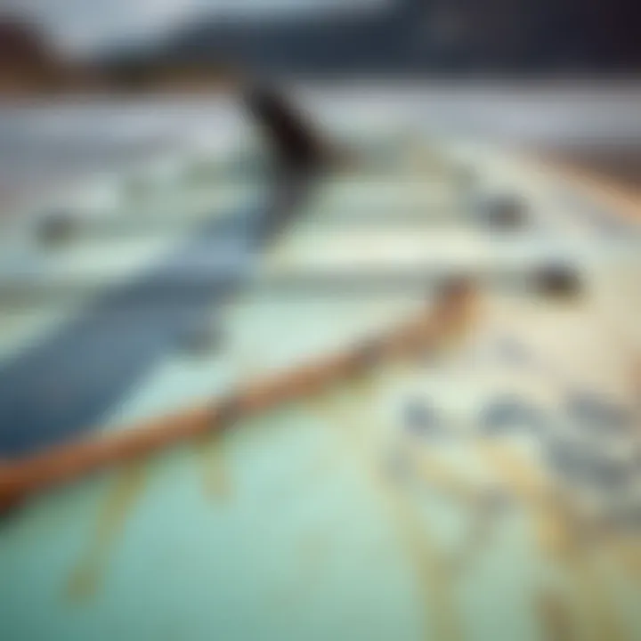 Assessing the Quality of Pre-Owned Boards Close-up of a used wing foil board showcasing its condition