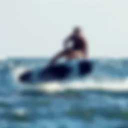 A foiling surfer gliding above the water's surface showcasing balance and control.