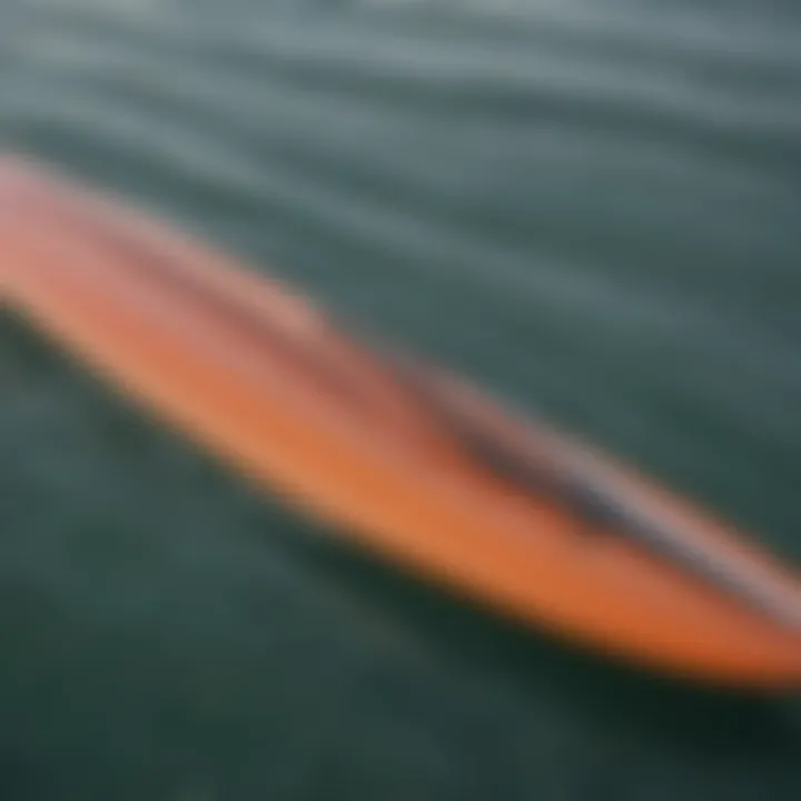 Close-up of a hydrofoil surfboard highlighting its sleek design and material craftsmanship