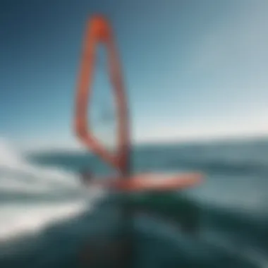 A hydrofoil windsurfing board gliding smoothly over the water