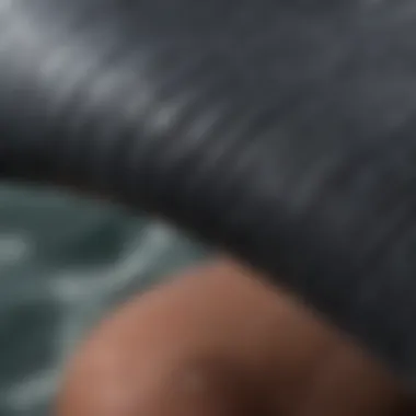 A close-up view of a flexible wetsuit material showcasing its texture and elasticity.