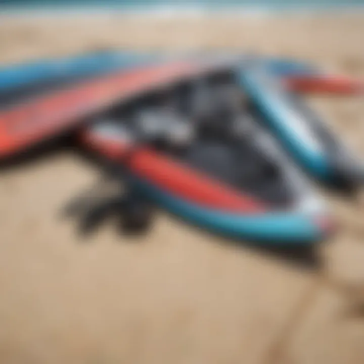 A close-up of essential kite surfing gear laid out on the beach.