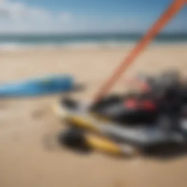 A close-up of essential kite surfing gear laid out on the beach.