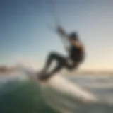 A kiteboarder gracefully gliding over the waves at Long Beach