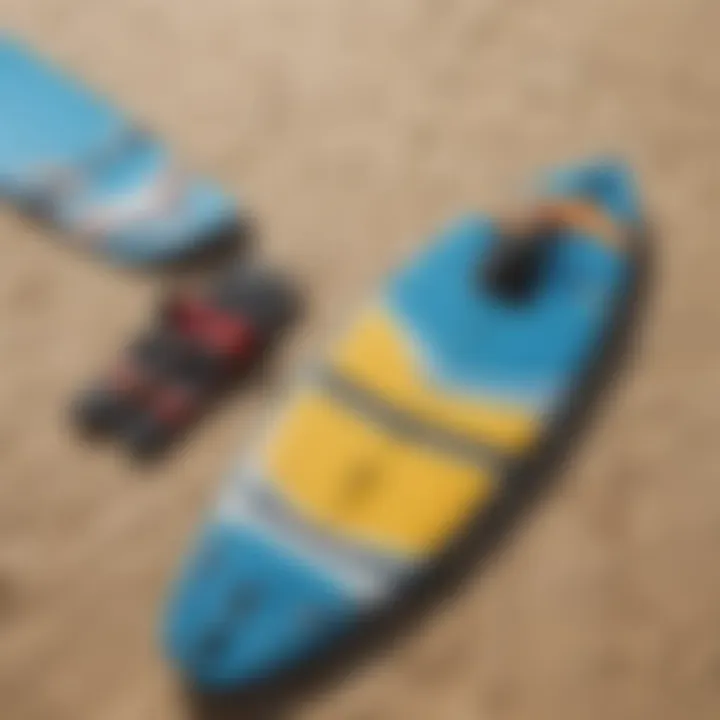 Close-up of kite surfing gear laid out on the sand