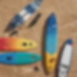 A variety of kiteboards displayed on a sandy beach