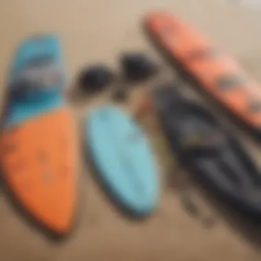 An array of kiteboarding equipment laid out on the beach