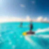 Kiteboarders Gliding Over Turquoise Waters A stunning view of kiteboarders gliding over the turquoise waters of Punta Cana