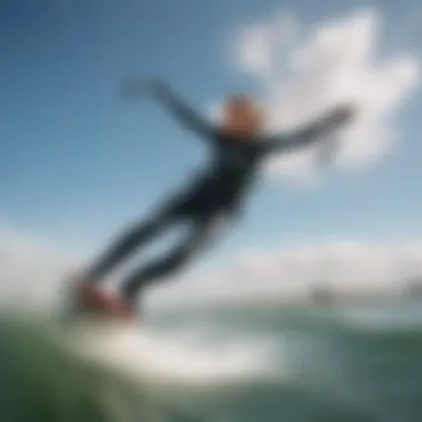 Kiteboarder wearing a wetsuit gliding over water