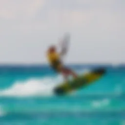 A kitesurfer skillfully maneuvering over vibrant turquoise waters