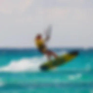 A kitesurfer skillfully maneuvering over vibrant turquoise waters