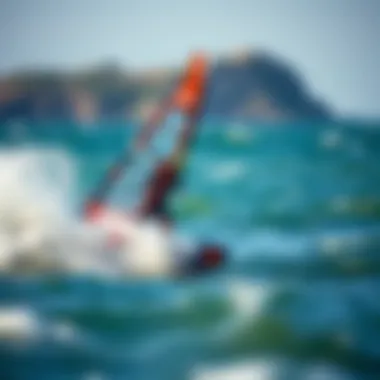 Naish Wing Foil Cutting Through Waves Naish wing foil in action on water