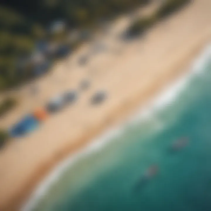 An aerial view of a vibrant kite surfing setup on a beach