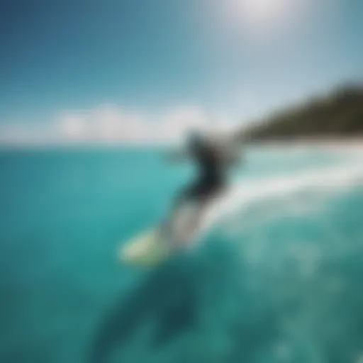 Kitesurfer gliding over turquoise waters